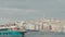 Tourist boat sails on background of Istanbul. Action. Boat with flag of Turkey floats on background of city on coast