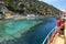 A tourist boat sales past a section of the Sunken City off Kekova Island in the western Mediterranean region of Turkey.