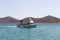 Tourist boat visiting Spinalonga Island, Crete