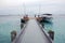 Tourist boat and visitors at concrete pier Maldives