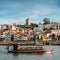 Tourist boats on the Douro River at the famous UNESCO World Heritage Site of Cais Ribeira overlooking Vila Nova de Gaia