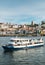 Tourist boats on the Douro River at the famous UNESCO World Heritage Site of Cais Ribeira overlooking Vila Nova de Gaia