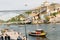 Tourist boats on the Douro River at the famous UNESCO World Heritage Site of Cais Ribeira overlooking Vila Nova de Gaia