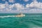Tourist boats sail to the wild Stingray city on Gran Cayman island, BWI