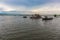 Tourist Boats Sailing Down a River under Blue Sky