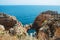 Tourist boats on turquoise sea water at Ponta da Piedade, Algarve region, Portugal