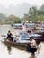 Tourist boats at the warf on the way to Perfume Pagoda, a popular day trip from Hanoi