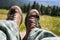 Tourist boots with mountain view on sunny day