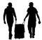 Tourist boys travelers carrying suitcase silhouette.