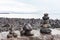 Tourist built stacks of rocks in Reykjavik on the sea wall