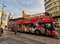 Tourist bus passes through the famous and central street Gran VÃ­a in Madrid