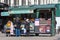 Tourist buying a Belgian waffle at a restaurant food street market stall