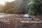 Tourist camping tent on wild ocean beach on tropical island