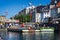 Tourist canal tour boats in the Canal at historic Nyhavn district in Copenhagen, Denmark