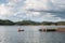 Tourist canoeing on lake in dam with blue sky