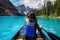 Tourist Canoeing on Moraine Lake in Banff National Park, Canadian Rockies, Alberta, Canada