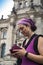 Tourist checking her smartphone in front of Reichstag