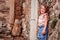 Tourist child girl at stone wall on the walk in Piran, Slovenia