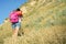 Tourist climbs the mountain