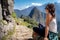 Tourist contemplating the beautiful landscape of Machu Picchu.