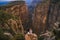 Tourist couple on the edge of a cliff of Tazi Canyon in Manavgat, Antalya, Turkey. Greyhound Canyon, Wisdom Valley.