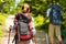 Tourist couple hiking in forest