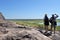 Tourist couple hiking at Ubirr rock art site in Kakadu National