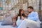 Tourist couple relaxed inside a beach parasol