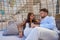 Tourist couple relaxed inside a beach parasol