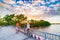 Tourist couple riding bicycle in the Mekong Delta region, Ben Tre, South Vietnam. Woman and man having fun cycling among green