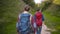 Tourist couple traveling, walking in nature.