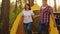 Tourist couple waking up in camping tent at sunny morning. Happy couple yawning and stretching hands on tourist tent