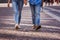 Tourist couple walking on cobblestone street vacation in europe on holiday break