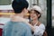 Tourist couples showing their love and happiness in a sweet way while waiting for their journey at the train station.