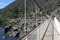 Tourist crossing Alexandra Suspension bridge in Tasmania Australia