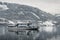 Tourist cruise in Austria Zell am See on frozen lake with snow and beautiful mountains on the background. Tourist ship boat s