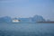 Tourist cruise ship sailing in the sea of Halong Bay, Vietnam