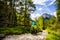 Tourist cycling in Cortina d `Ampezzo, stunning rocky mountains on the background. Man riding MTB enduro flow trail. South Tyrol