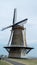 Tourist destination, traditional Dutch windmill on sea shore, Vlissingen, Zeeland, Netherlands