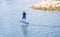 Tourist is on an electric hydrofoil, flying above the water. French riviera