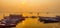 Tourist enjoying boat ride on Ganga / Ganges river during sunrise