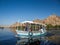 Tourist enjoying a ride on a small boat cruising the river Nile near Aswan, Egypt