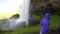 Tourist Enjoying Spectacular Waterfall Iceland