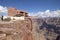 Tourist enjoying the view of the west rim of The Grand Canyon from the Skywalk