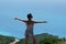 A tourist enjoys the splendid view of the panorama of Porto Katsiki in Lefkada