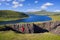 Tourist enjoys the view of Lake Sorvagsvatn on Vagar Island, Faroe Islands
