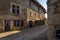 Tourist entering a cobblestone street of Perouges, France