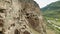 A tourist examines the sights of Georgia Vardzia cave monastery.