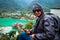 Tourist explores Dhari Devi Hindu temple amid monsoon in Alaknanda river, Rudraprayag, Uttarakhand, India. Serene pilgrimage site