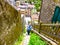 Tourist exploring the hillside of a small village in the Liguria region of Italy